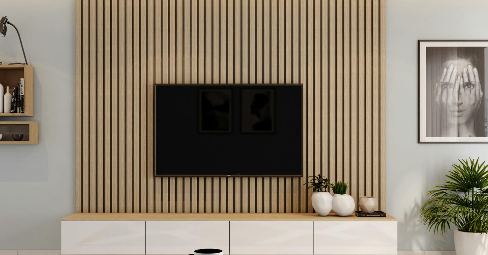 A wall-mounted TV on a slatted wood wall above a low white console, with no cords in sight
